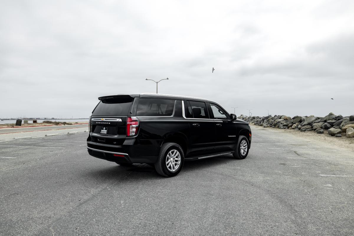 Black Chevrolet Suburban at coastal location with scenic background